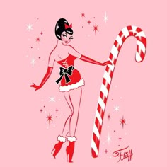 a woman holding a candy cane on top of a pink background