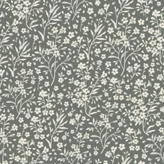 a gray and white floral wallpaper with small white flowers on the top of it