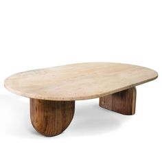 an oval table with wooden legs and a circular top, made out of plywood