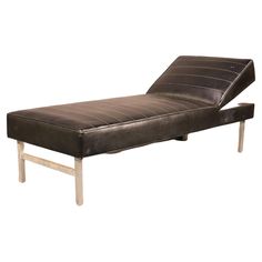 a brown leather chaise lounger with metal legs on an isolated white background for display