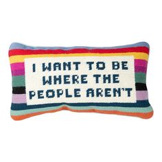 a colorful pillow with the words i want to be where the people aren't