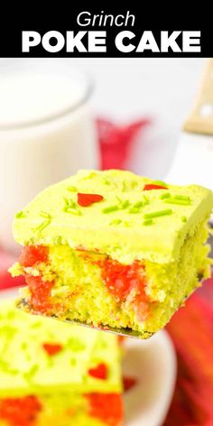 a close up of a piece of cake on a plate with a cup in the background