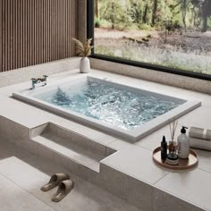 a bathroom with a large jacuzzi tub next to a window