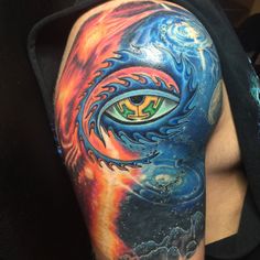 a man's arm with an all seeing eye tattoo on it