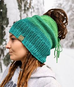 ♾️ Beanie with opening / Dreadtube ♾️ Handmade ♾️ 100% recycled cotton ♾️ Green fashion Overall Length: 25 cm Cap Picea: The cap "Picea" owes its name to the blue spruce. It has a great bright green gradient and is the perfect winter accessory to keep your ears warm on cold days. It is not a quickly produced mass product, but is knitted and refined by hand with a lot of love and care. The cap is open at the back, so you do not have to do without a braid even in winter. A ribbon allows the openin Textile Waste, Green Gradient, Blue Spruce, Slouchy Hat, Ear Warmers, Winter Accessories, Green Fashion, Bright Green, Style Ideas