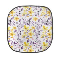 an oven mitt with yellow and purple flowers on it