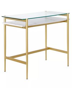 a glass table with gold legs and a white marble top on an isolated white background