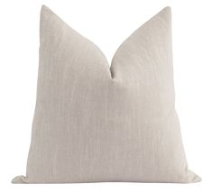 a white pillow on a white background with a light colored linen back and side that is slightly down