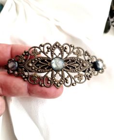 Excellent quality vintage inspired bronze filigree barrette with beautiful grayish silver gemstones. Total length is approximately 8 x 3 cm,metal clip is 7 cm. Suitable for all hair types, non slip.  This beautiful antique style handmade barrette perfect for daily wear and special occasions.  Thank you for visiting my items. Wedding Barrettes, Silver Filigree, Hair Types, Antique Style, Antique Bronze, Natural Stone, Natural Stones, Daily Wear, Vintage Inspired