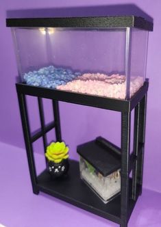 a fish tank sitting on top of a shelf