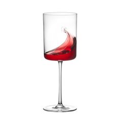 a wine glass with red liquid in it