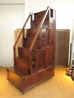 a staircase made out of wooden drawers in a room