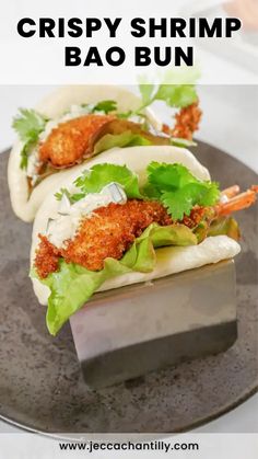 crispy shrimp bao bun on a plate with text overlay