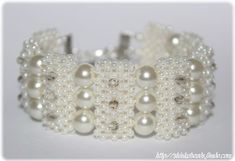 a white beaded bracelet with lots of pearls