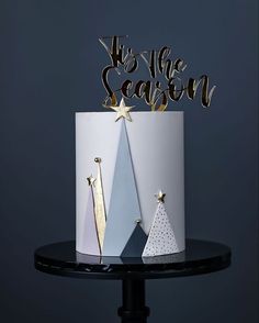 two christmas trees are on top of a cake with the words it's the season