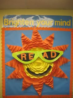 a bulletin board with the words read written on it and a smiling sun wearing sunglasses