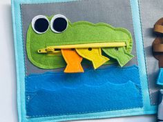 a close up of a piece of felt with a frog on it