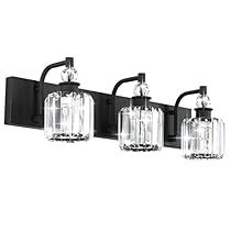 three lights are mounted on the wall with black brackets and clear glass shades in front of them