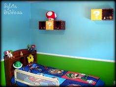 a child's bedroom with blue walls and green trim, including a mario mouse bed