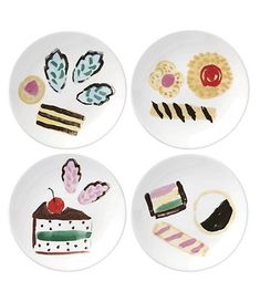 four plates with different designs on them, one has a piece of cake and the other has desserts