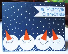 a christmas card with three snowmen on it