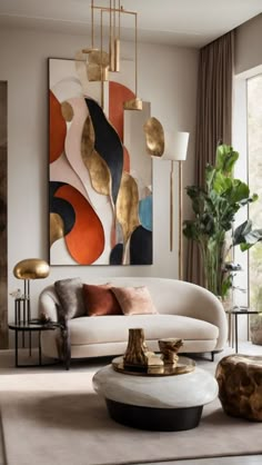 a living room with modern furniture and art on the wall