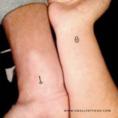 two people with matching tattoos on their arms