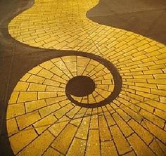 an image of a walkway made out of cobblestones with a circle in the middle