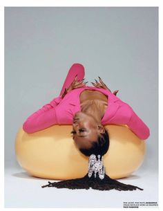 a woman laying on top of an inflatable object