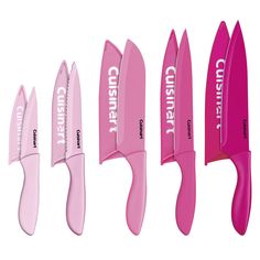 three different types of pink knives with white writing on the blades and one is holding a knife