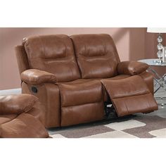 the reclining loveseat has two seats and a footstool in front of it