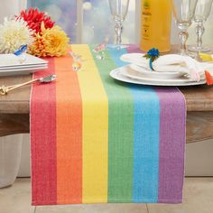 a rainbow table runner on a dining room table