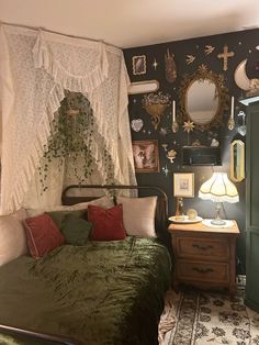 a bed sitting in a bedroom next to a green dresser and mirror on the wall