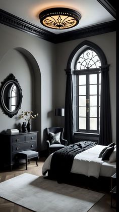 a bedroom with arched windows and black furniture