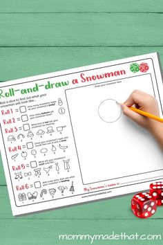 roll and draw a snowman activity sheet with dices on the table next to it