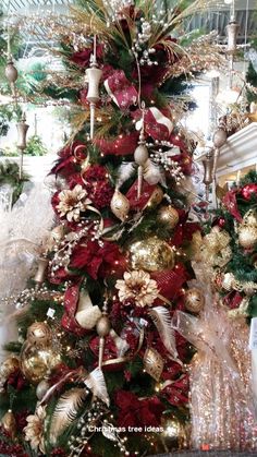 a christmas tree decorated with red and gold ornaments