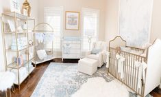 a baby's room is decorated in white and gold