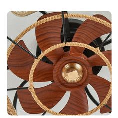 a close up of a wooden fan on a wall