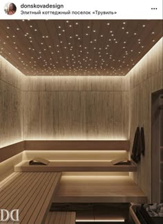 an indoor sauna with wooden benches and lights