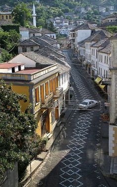 an aerial view of a city street with buildings