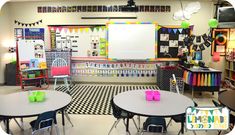 a classroom with tables and chairs in it