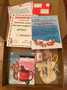 an open box filled with christmas cards and other items