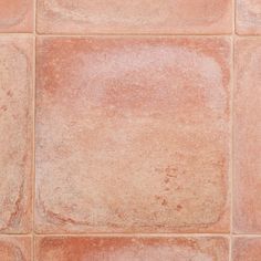 a close up view of an orange tile floor