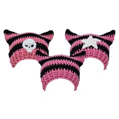 two pink and black crocheted hats with skulls on the front, one has a skull in the middle