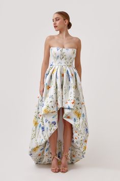 Make a statement in our show-stopping Marguerite gown, a one-of-a-kind custom printed neoprene dress featuring a strapless bodice, cinched waist, and dramatic ballon pleated skirt. This high-low hem dress boasts a short front and stunning train at the back, perfect for making a glamorous entrance at your bridal shower, wedding, or as a stunning wedding guest dress. *Chiffon scarf sold separately* Hand wash or dry clean Neoprene Dress, Dress Chiffon, Chiffon Scarf, Guest Dress, Short Rompers, Hem Dress, High Low Hem, Cinched Waist, Wedding Guest Dress