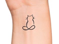 Cat Infinity Temporary Tattoo Size: The size of this Temporary Tattoo is approximately 1 inch in length. If you would like this design in a smaller or larger size that isn't already listed, please message us directly on Etsy BEFORE placing your order so we can provide you with accurate pricing. Directions: 1. Cut excess paper around tattoo with scissors to eliminate any unnecessary adhesive on your skin after applying. 2. Peel away and discard the clear plastic layer. 3. Apply the tattoo image side to your skin and cover with a damp cloth for 20 seconds. 4. Carefully peel back paper off of your skin and allow the tattoo to dry for at least 10 seconds. Do not touch it. 5. After allowing for dry time, your tattoo should be smooth to the touch and last between 1-3 days. Temporary Tattoo Longe Cat Infinity Tattoo, Cute Cat Tattoo Simple, Cat Tattoo Designs Unique, Tattoos For Women Cat, Cat Outline Tattoo, Cat Tattoo Simple, Tattoo Thoughts, Cat Tattoos, Cat Tattoo Designs