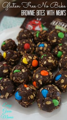 a plate full of chocolate balls with candy on top