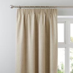 an open window with a curtain in front of it