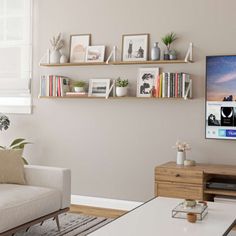 a living room filled with furniture and a flat screen tv mounted on a wall above a wooden coffee table