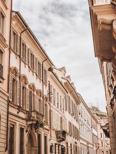 an old european street lined with tall buildings